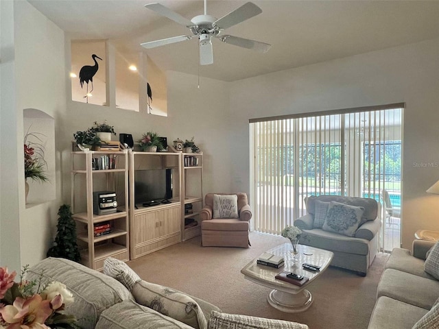 living room featuring carpet floors and ceiling fan