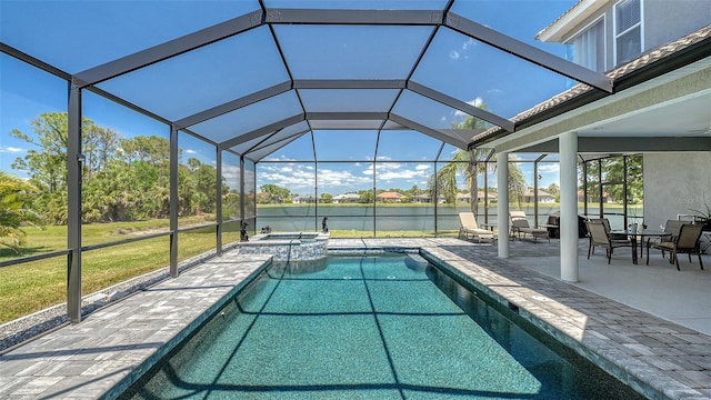 1085 Mallard Marsh Dr, Osprey, FL 34229 - view of swimming pool with a pool with connected hot tub, a lanai, a patio, and a water view