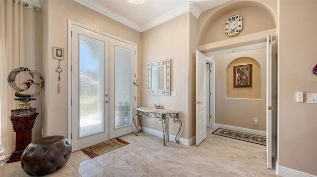 1085 Mallard Marsh Dr, Osprey, FL 34229 - foyer with crown molding, baseboards, and french doors