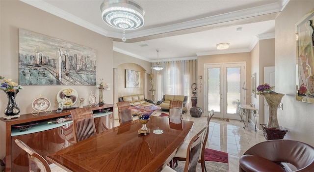 1085 Mallard Marsh Dr, Osprey, FL 34229 - dining room with light tile patterned floors, french doors, a notable chandelier, and ornamental molding