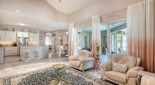 1085 Mallard Marsh Dr, Osprey, FL 34229 - living room with plenty of natural light, vaulted ceiling, marble finish floor, and arched walkways