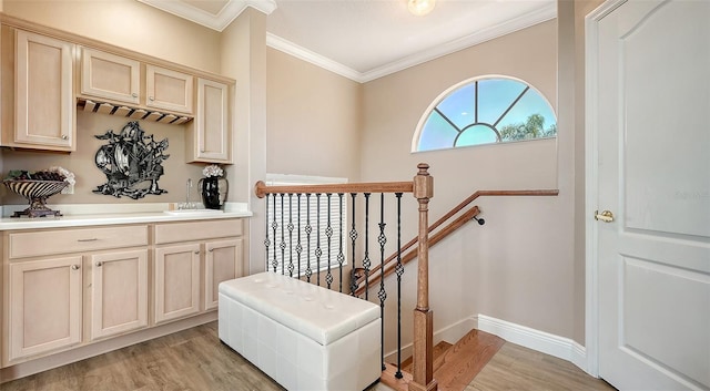 1085 Mallard Marsh Dr, Osprey, FL 34229 - interior space featuring baseboards, crown molding, a sink, and light wood-style flooring