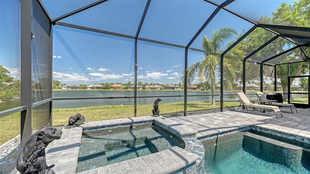 1085 Mallard Marsh Dr, Osprey, FL 34229 - view of swimming pool with a water view, a lanai, a yard, a pool with connected hot tub, and a patio