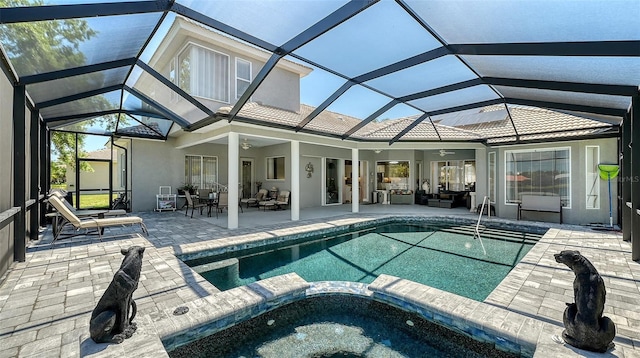 1085 Mallard Marsh Dr, Osprey, FL 34229 - rear view of house featuring an outdoor hangout area, stucco siding, ceiling fan, a patio area, and a pool with connected hot tub