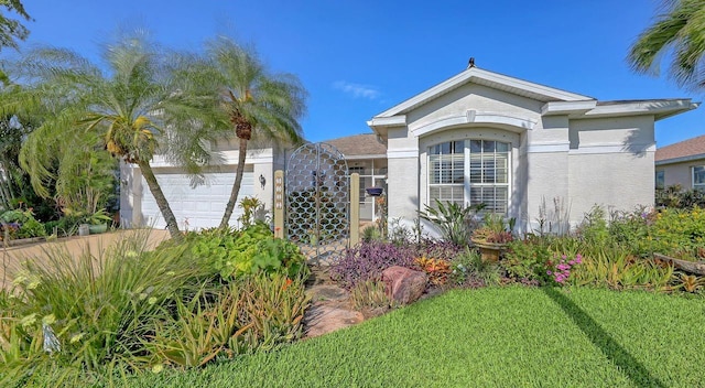 5022 46th St W, Bradenton, FL 34210 - view of front of house with an attached garage and stucco siding