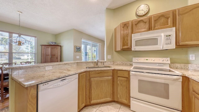 5022 46th St W, Bradenton, FL 34210 - kitchen with a textured ceiling, a sink, a peninsula, a notable chandelier, and white appliances