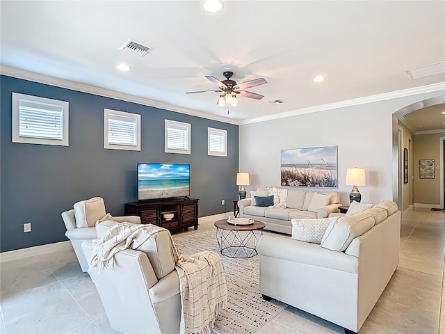13724 Quinta St, Venice, FL 34293 - living room with ornamental molding, visible vents, ceiling fan, arched walkways, and baseboards