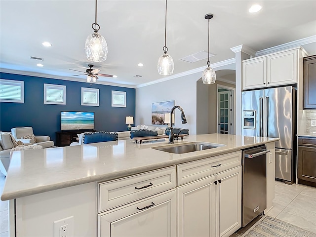 13724 Quinta St, Venice, FL 34293 - kitchen with a sink, stainless steel appliances, visible vents, crown molding, and open floor plan