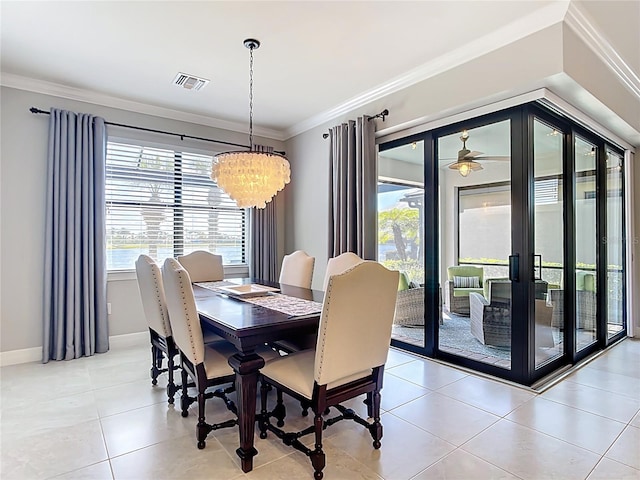 13724 Quinta St, Venice, FL 34293 - dining space with baseboards, ornamental molding, visible vents, light tile patterned flooring, and a chandelier