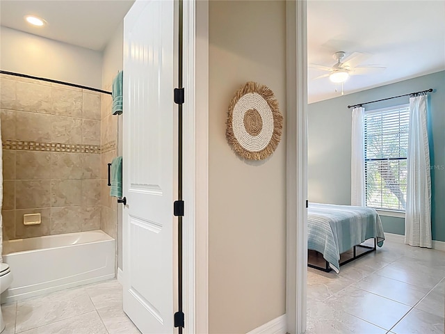 13724 Quinta St, Venice, FL 34293 - ensuite bathroom featuring baseboards, a ceiling fan, shower / bathtub combination, and tile patterned floors