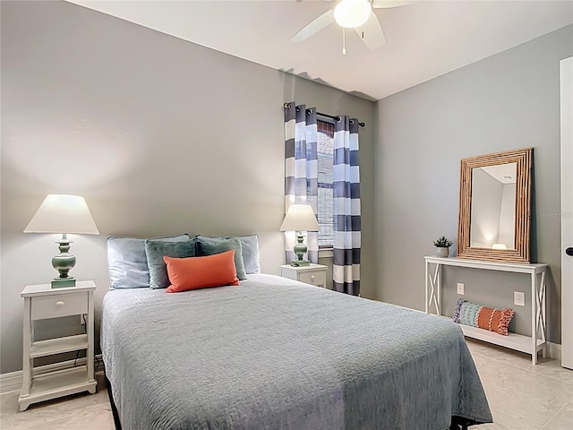 13724 Quinta St, Venice, FL 34293 - bedroom with a ceiling fan and baseboards