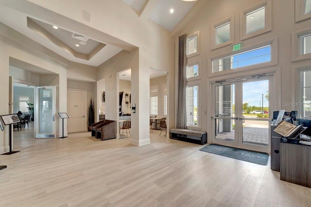 15719 Barefoot Beach Dr, Lakewood Ranch, FL 34211 - foyer featuring french doors, a high ceiling, light wood-style floors, and recessed lighting
