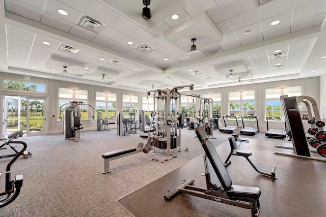 15719 Barefoot Beach Dr, Lakewood Ranch, FL 34211 - gym with plenty of natural light, a tray ceiling, and recessed lighting