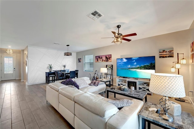 15719 Barefoot Beach Dr, Lakewood Ranch, FL 34211 - living room featuring a ceiling fan and wood finished floors