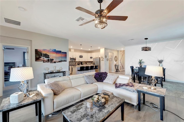 15719 Barefoot Beach Dr, Lakewood Ranch, FL 34211 - living area with ceiling fan, light wood finished floors, and recessed lighting