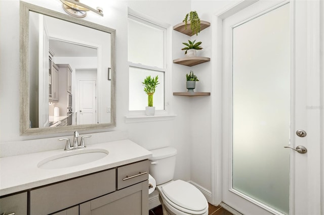 4712 Margutta Ct, Sarasota, FL 34240 - half bathroom with toilet and vanity