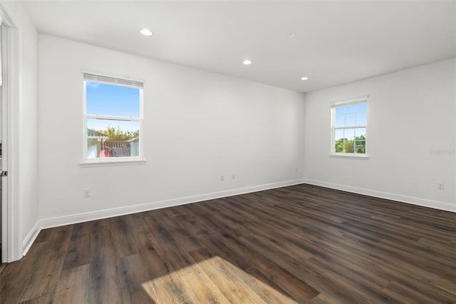 4712 Margutta Ct, Sarasota, FL 34240 - unfurnished room with dark wood-type flooring, baseboards, and recessed lighting