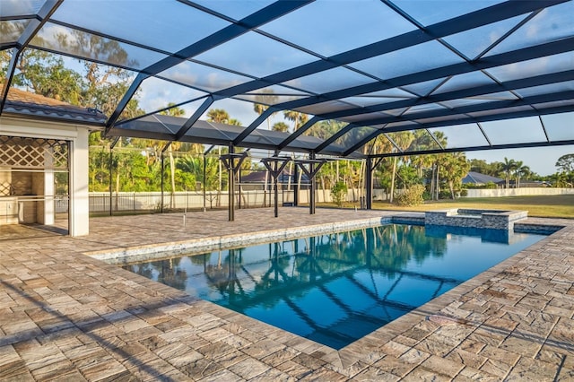 4712 Margutta Ct, Sarasota, FL 34240 - view of swimming pool with a patio area, a pool with connected hot tub, glass enclosure, and area for grilling