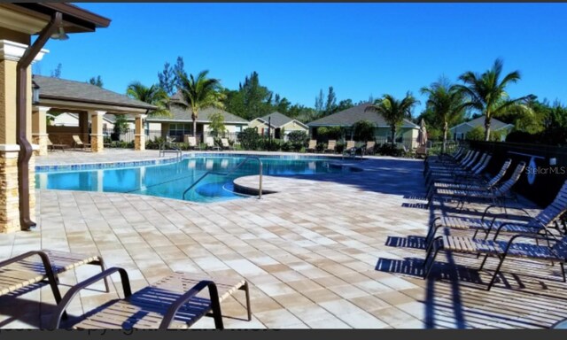 community pool featuring a patio area