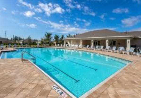 pool with a patio area