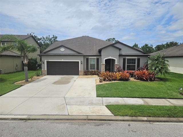 11092 58th Street Cir E, Parrish, FL 34219 - ranch-style house featuring driveway, an attached garage, and a front lawn