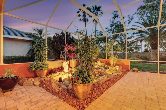 patio terrace at dusk with a lanai