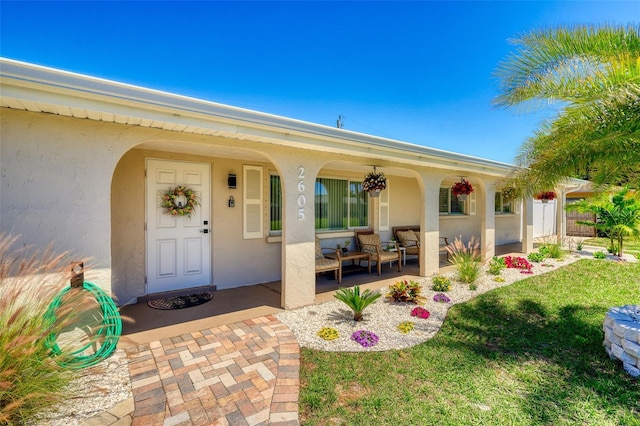 2605 Sunnybrook Dr, Sarasota, FL 34239 - property entrance with covered porch and stucco siding