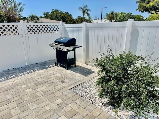 2605 Sunnybrook Dr, Sarasota, FL 34239 - view of patio / terrace with fence and area for grilling