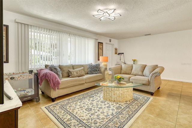 2605 Sunnybrook Dr, Sarasota, FL 34239 - living area featuring a textured ceiling, light tile patterned flooring, and visible vents