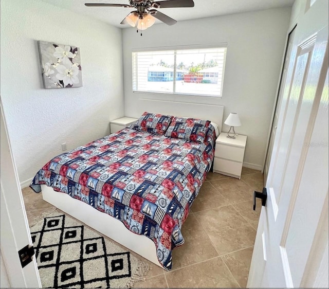 2605 Sunnybrook Dr, Sarasota, FL 34239 - tiled bedroom with baseboards and ceiling fan