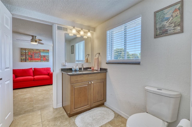 2605 Sunnybrook Dr, Sarasota, FL 34239 - bathroom featuring a textured wall, vanity, toilet, a textured ceiling, and visible vents