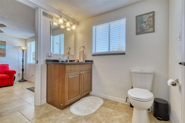 2605 Sunnybrook Dr, Sarasota, FL 34239 - bathroom featuring vanity, toilet, a textured ceiling, and visible vents