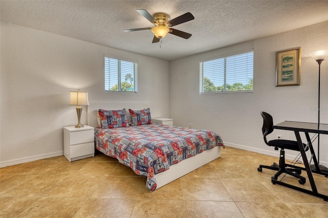 2605 Sunnybrook Dr, Sarasota, FL 34239 - bedroom featuring a textured ceiling, multiple windows, and baseboards