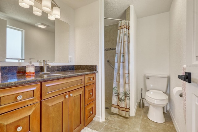 2605 Sunnybrook Dr, Sarasota, FL 34239 - full bath with vanity, toilet, baseboards, tiled shower, and tile patterned floors