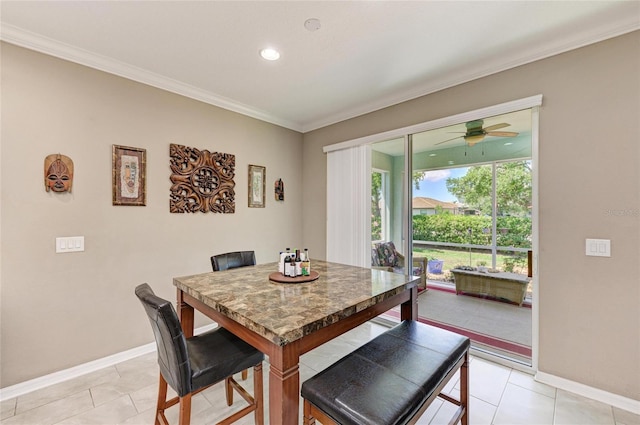 dining room with baseboards, ceiling fan, and ornamental molding