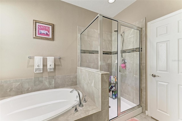 full bathroom with a stall shower and a garden tub