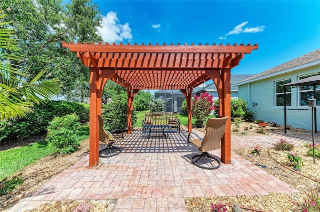 view of patio featuring outdoor dining area and a pergola
