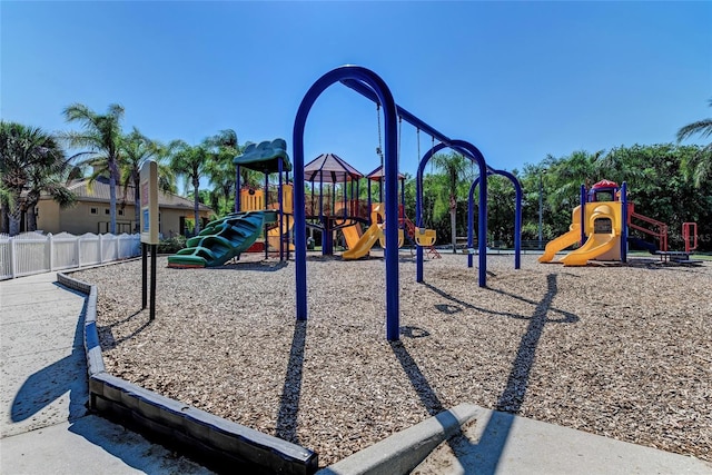communal playground featuring fence