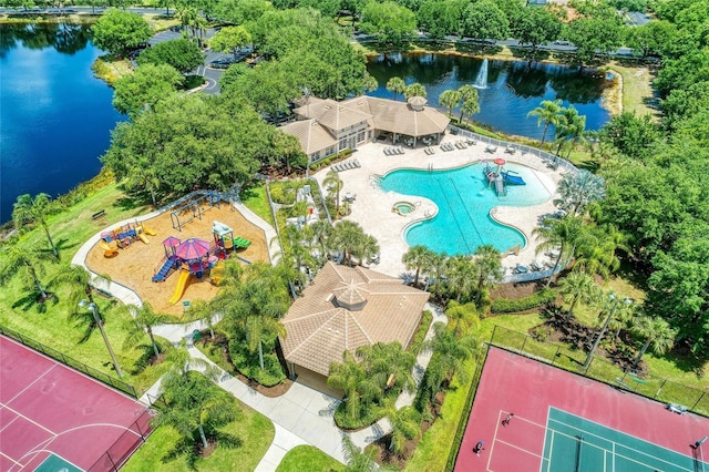 birds eye view of property with a water view