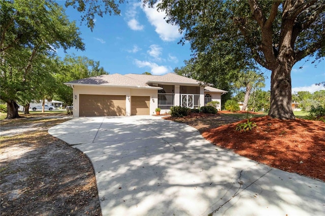 1860 Citron St, Punta Gorda, FL 33980 - view of front of home featuring a garage, stucco siding, and concrete driveway