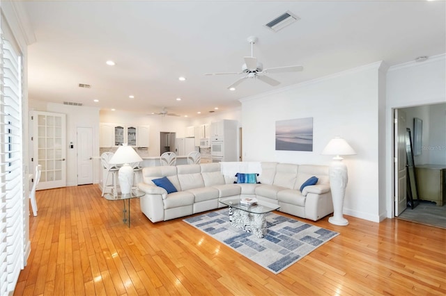 1860 Citron St, Punta Gorda, FL 33980 - living area with light wood finished floors, ceiling fan, ornamental molding, and visible vents