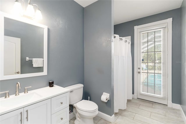 1860 Citron St, Punta Gorda, FL 33980 - full bathroom with toilet, a shower with shower curtain, vanity, and baseboards