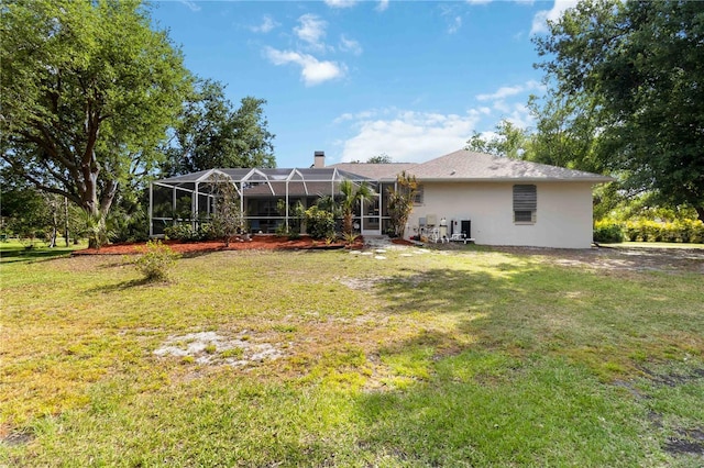 1860 Citron St, Punta Gorda, FL 33980 - rear view of property with a lanai, a yard, and a chimney
