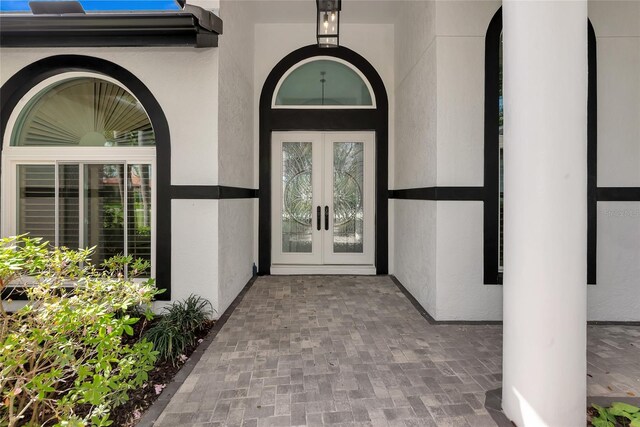 600 Eagle Watch Ln, Osprey, FL 34229 - view of exterior entry with french doors and stucco siding