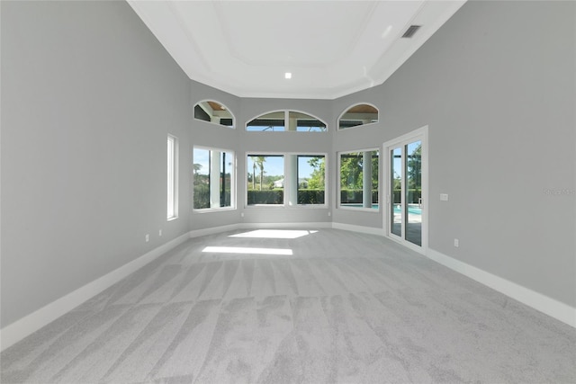 600 Eagle Watch Ln, Osprey, FL 34229 - carpeted spare room featuring a raised ceiling and a high ceiling