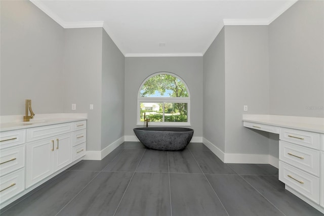 600 Eagle Watch Ln, Osprey, FL 34229 - bathroom with a freestanding bath, vanity, ornamental molding, and tile patterned flooring