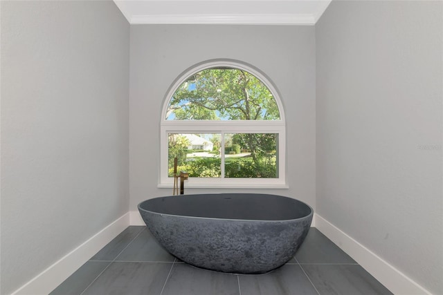 600 Eagle Watch Ln, Osprey, FL 34229 - full bathroom featuring healthy amount of natural light, a soaking tub, tile patterned floors, and ornamental molding