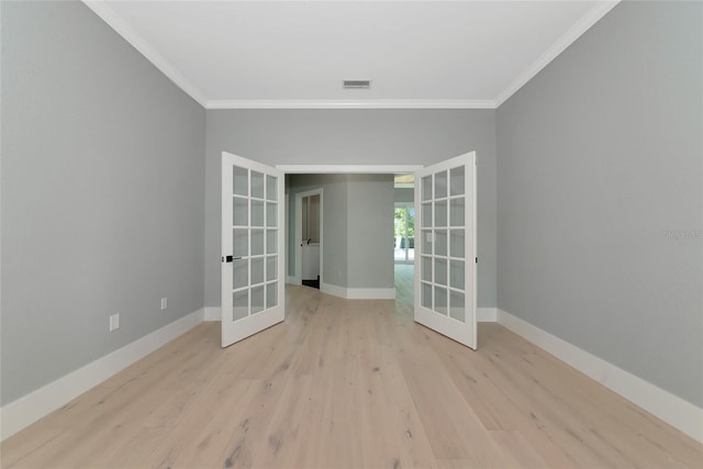 600 Eagle Watch Ln, Osprey, FL 34229 - empty room with french doors, ornamental molding, and wood finished floors