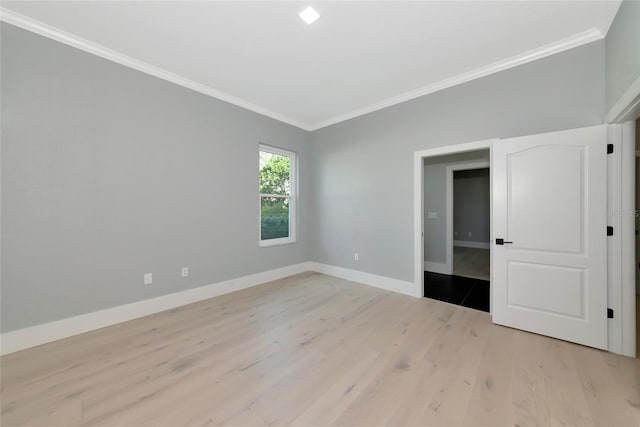 600 Eagle Watch Ln, Osprey, FL 34229 - unfurnished bedroom with ornamental molding and light wood-type flooring