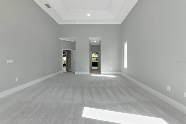 600 Eagle Watch Ln, Osprey, FL 34229 - unfurnished room featuring light carpet, a raised ceiling, and crown molding